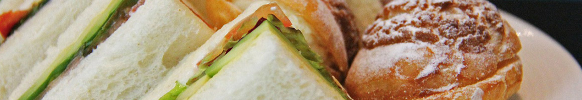 Eating Deli Sandwich at Big Apple Deli restaurant in Oregon, OH.